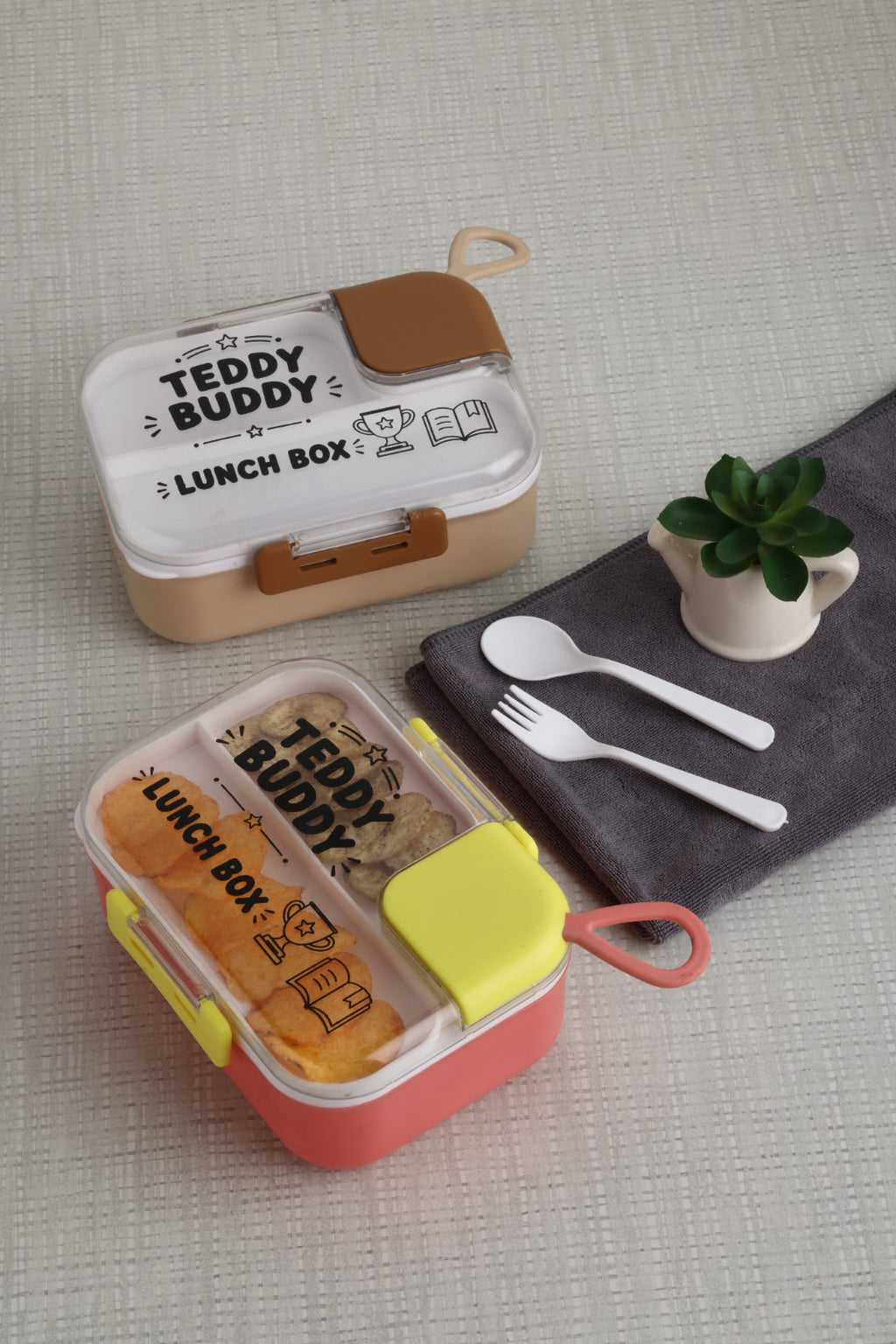 Teddy Buddy lunch box packed with sandwiches, chips and chutney in the sauce compartment